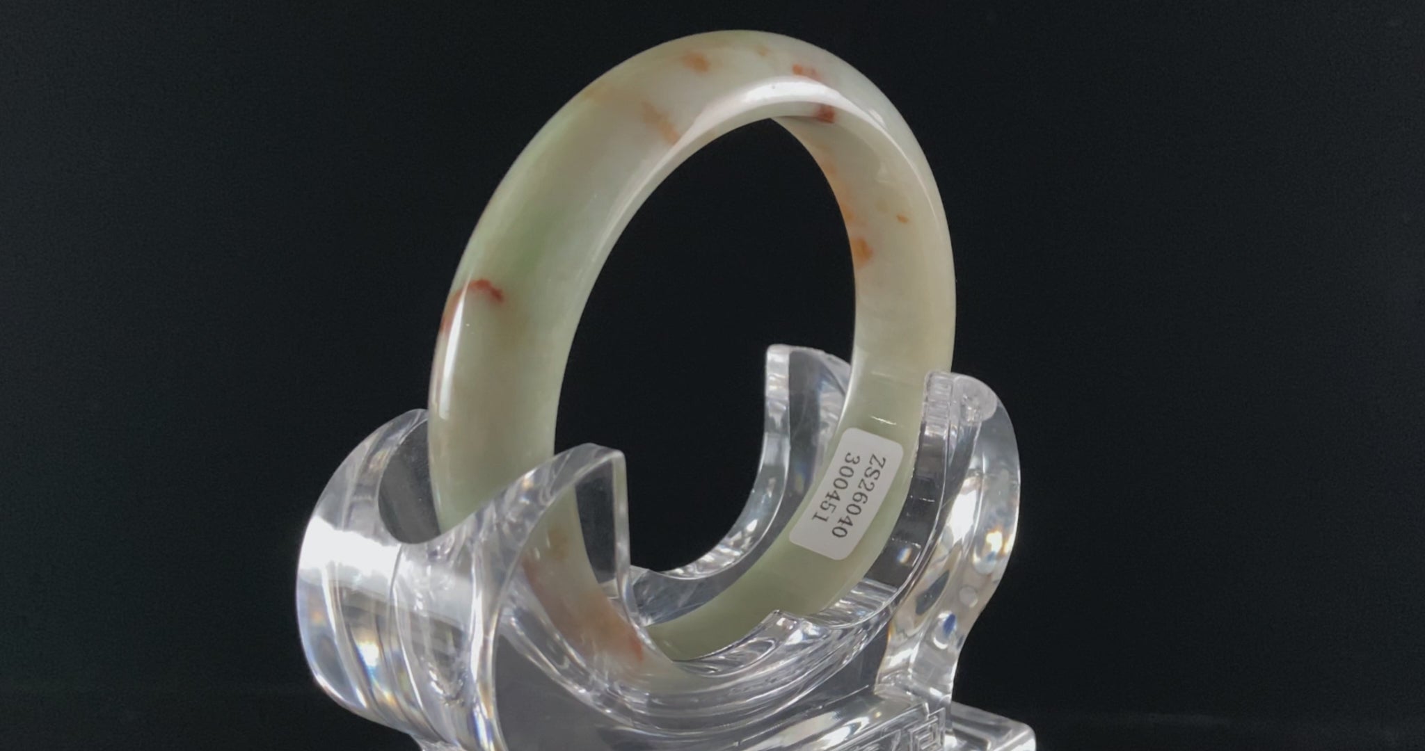 A moss coral calm jadeite bangle.