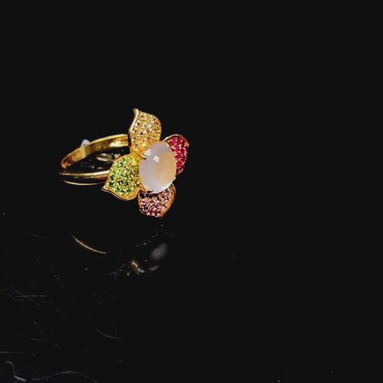 A icy white with vibrant petal jadeite ring.