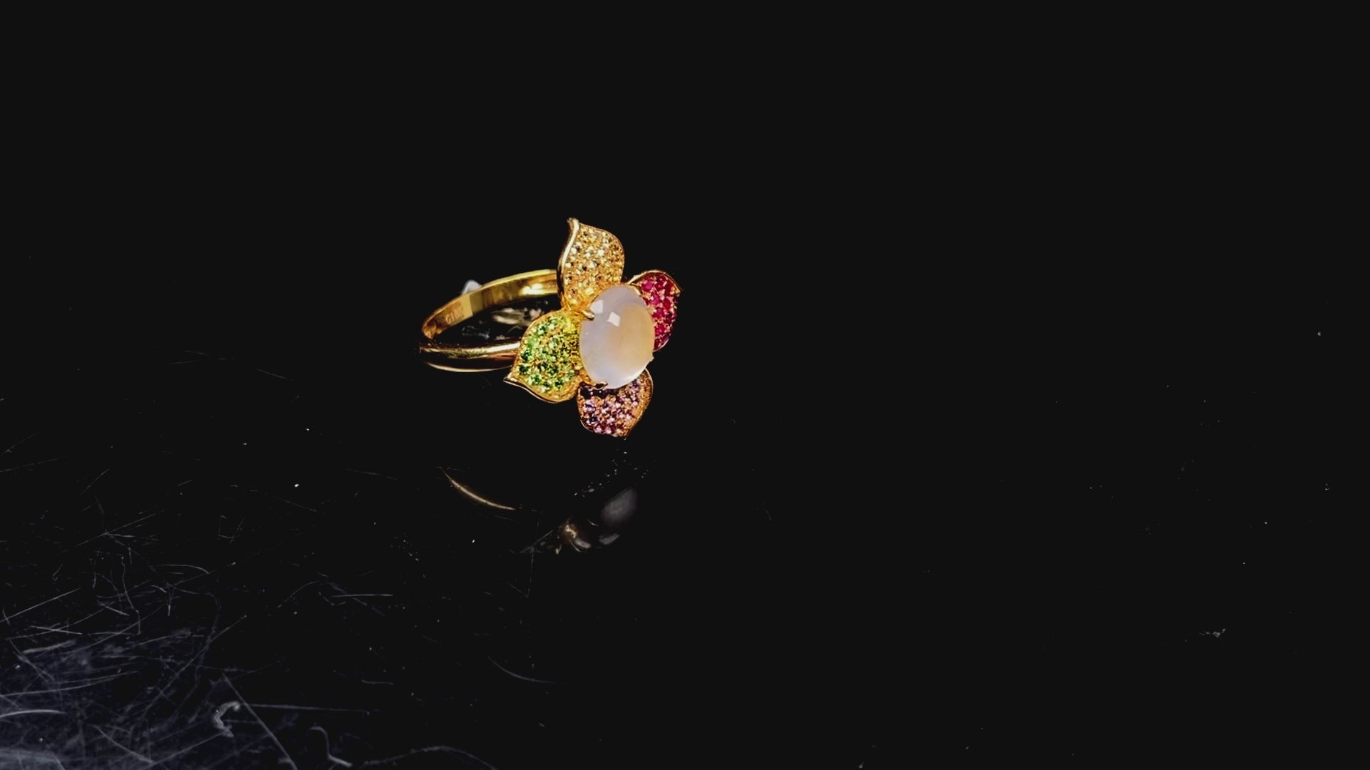 A icy white with vibrant petal jadeite ring.