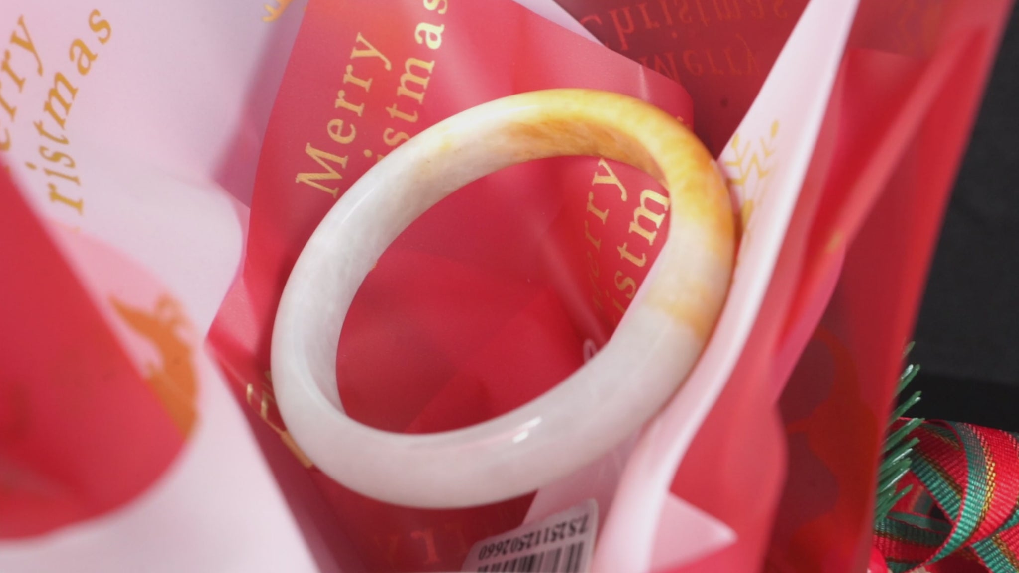 A ivory base with warm amber accent  jadeite bangle.
