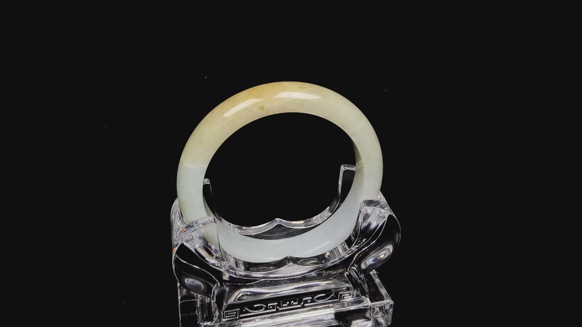 A creamy gold veil jadeite bangle.
