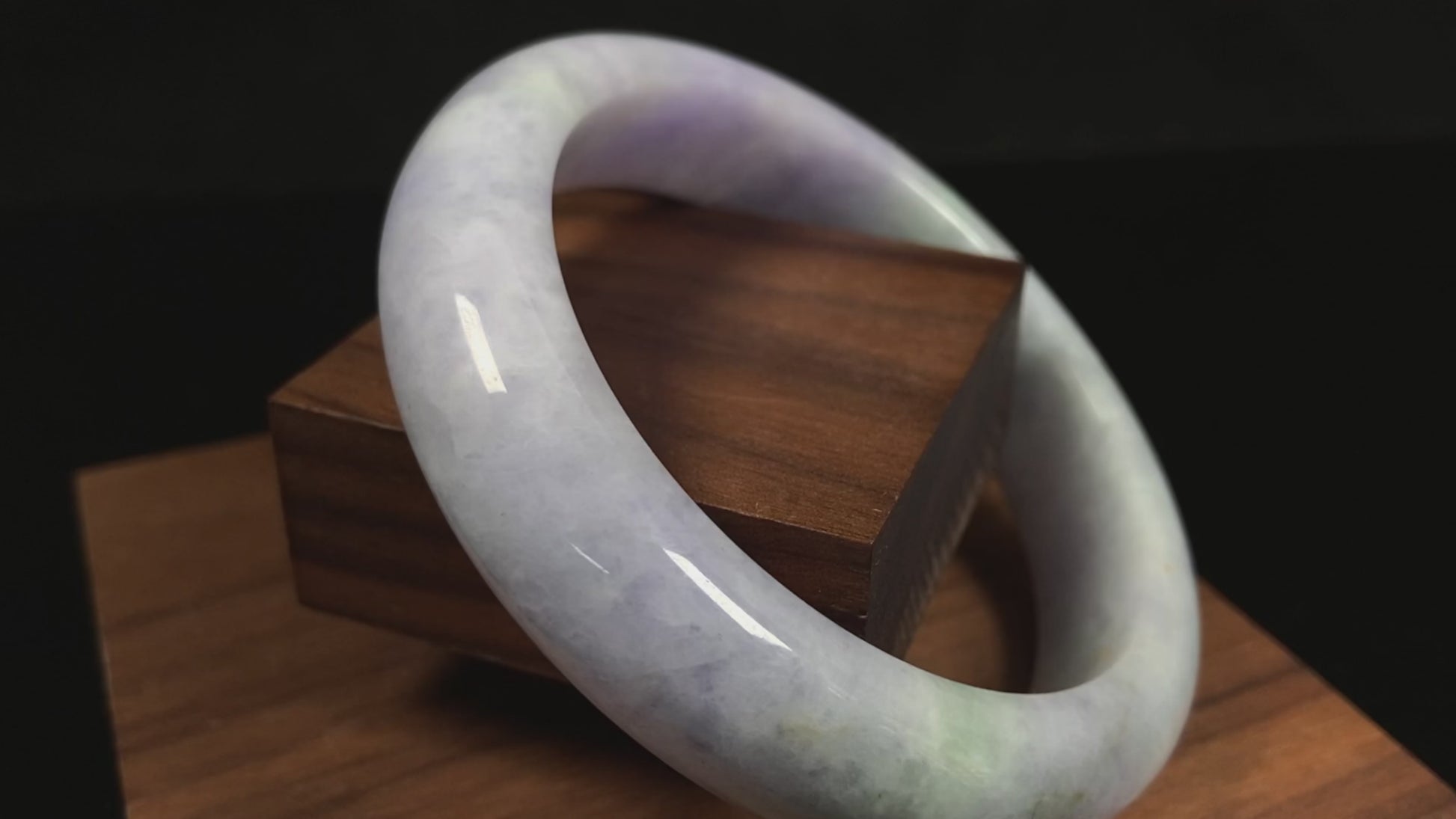 A pale lavender purple base with gentle green accents jadeite bangle.