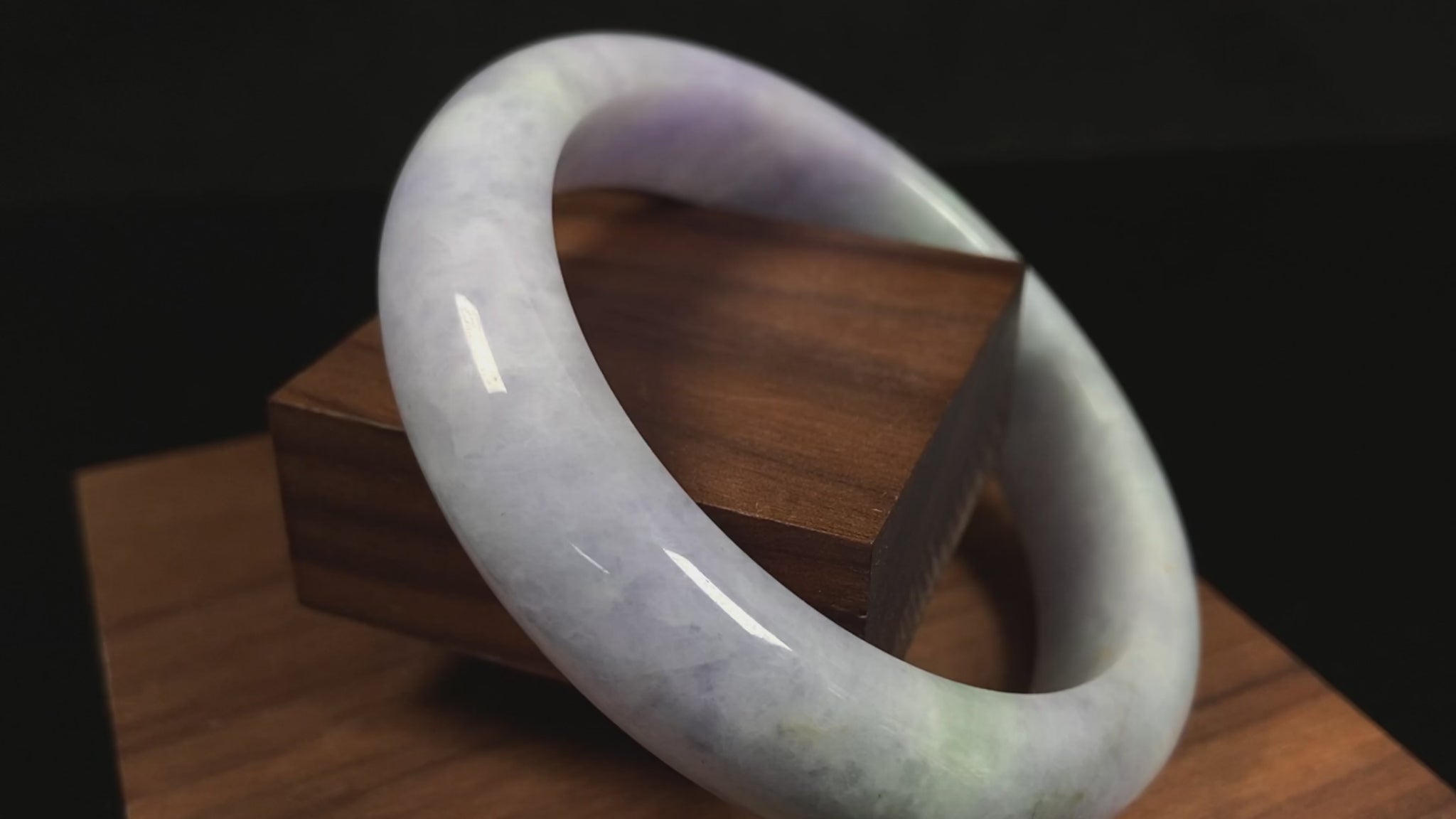 A pale lavender purple base with gentle green accents jadeite bangle.