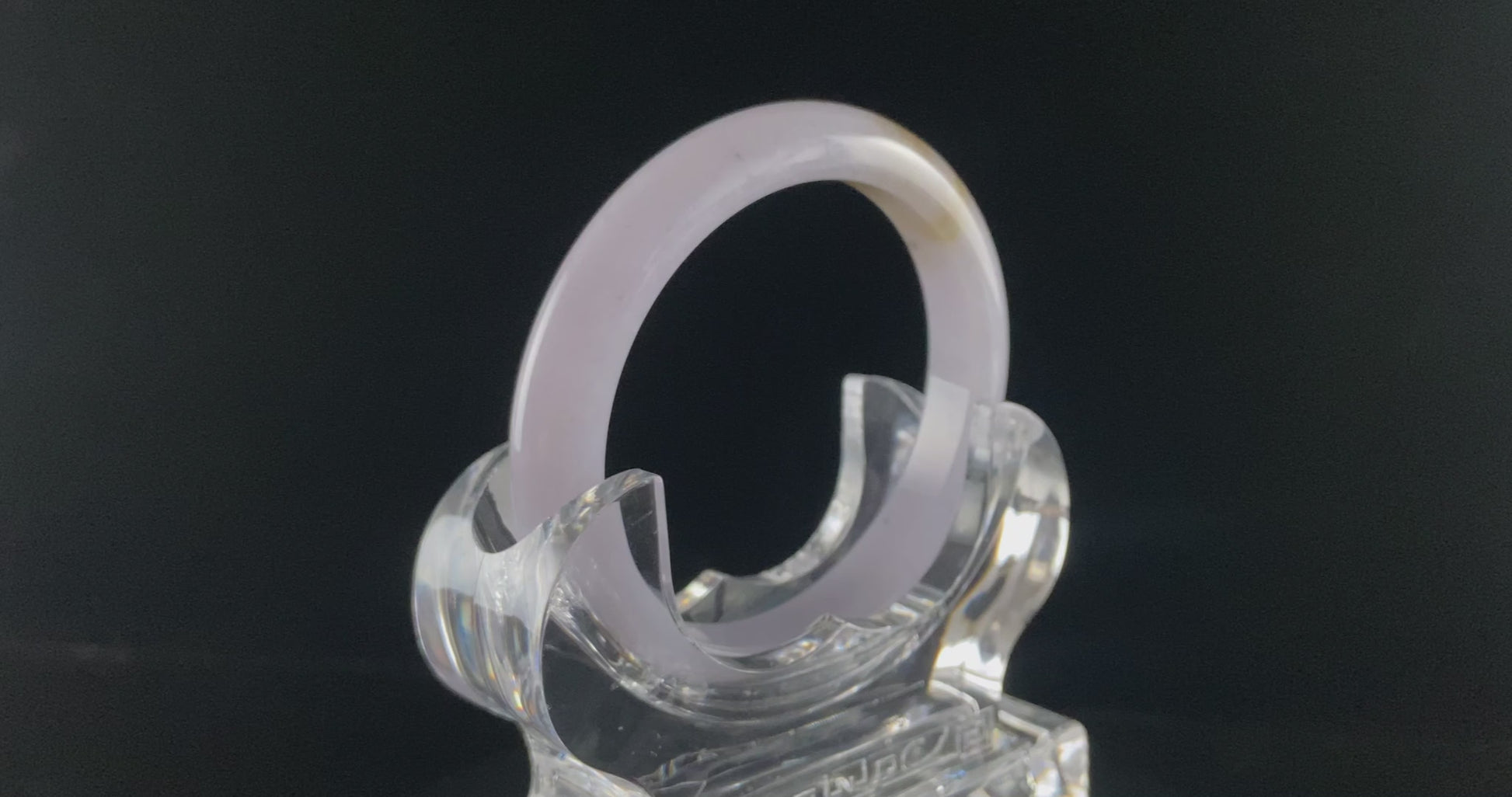 A lavender golden tip jadeite bangle.