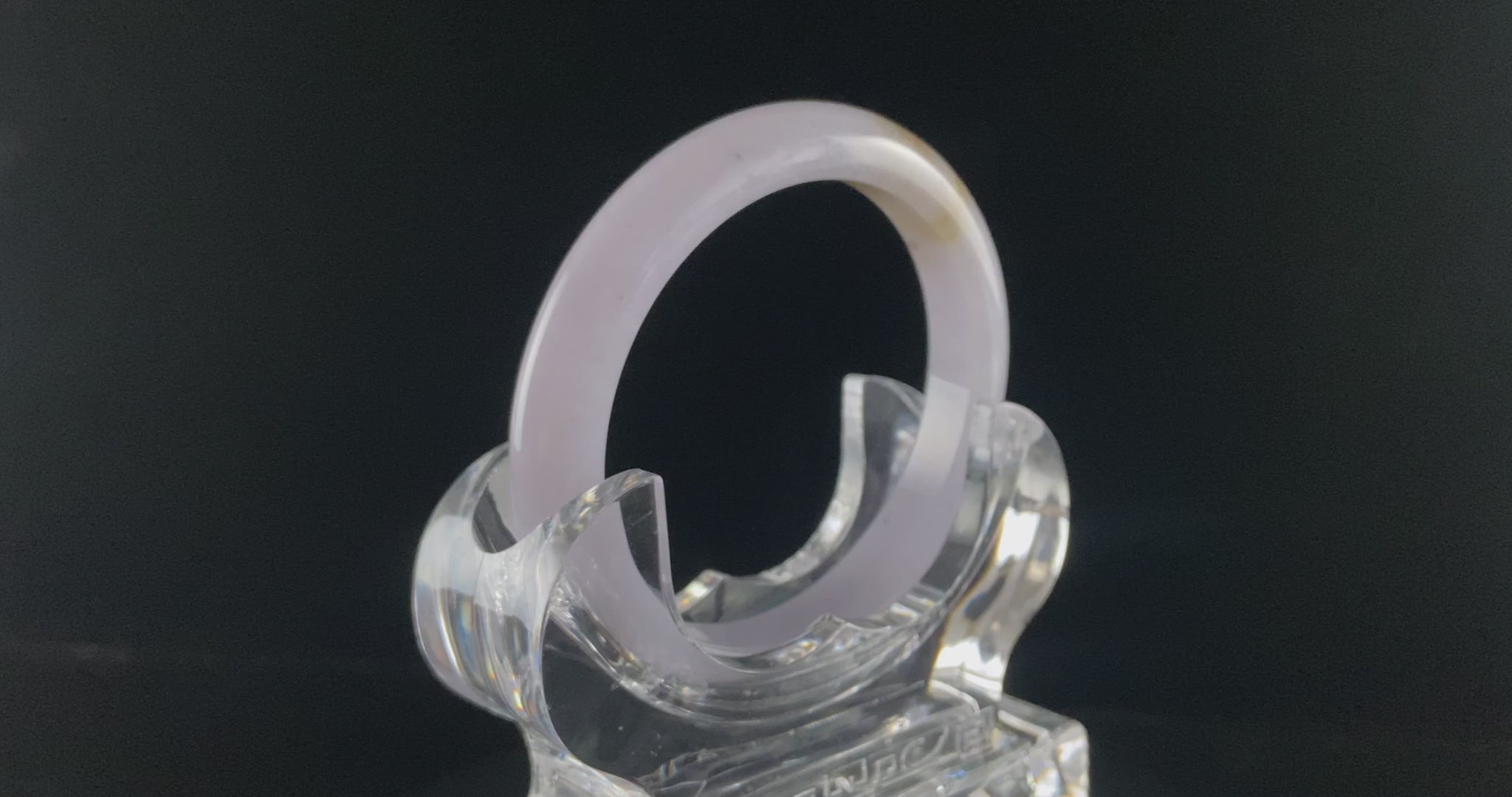 A lavender golden tip jadeite bangle.