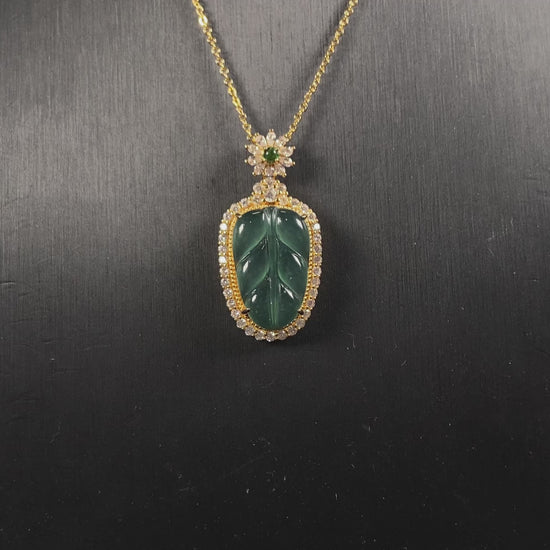 A deep aqua leaf vein jadeite pendant.