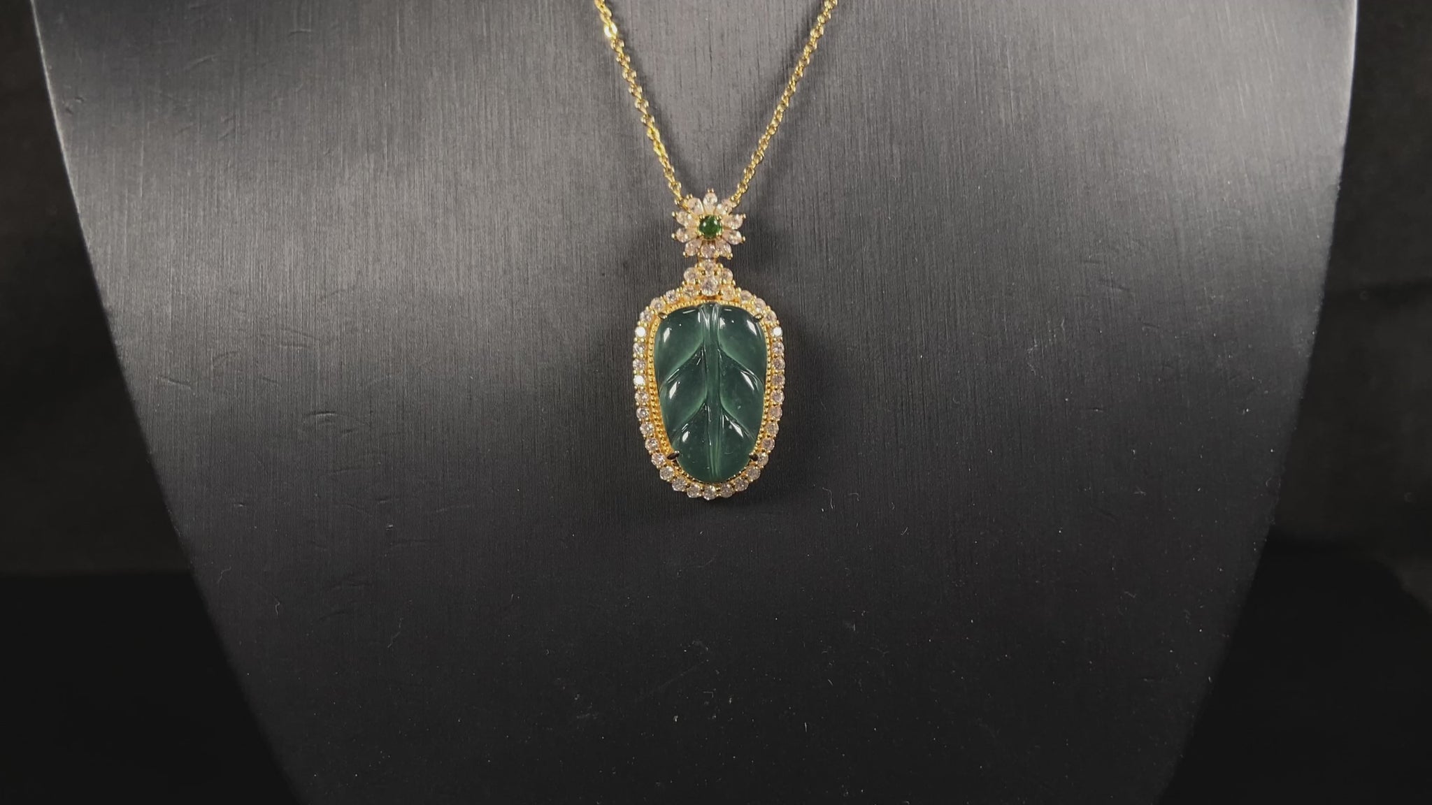 A deep aqua leaf vein jadeite pendant.