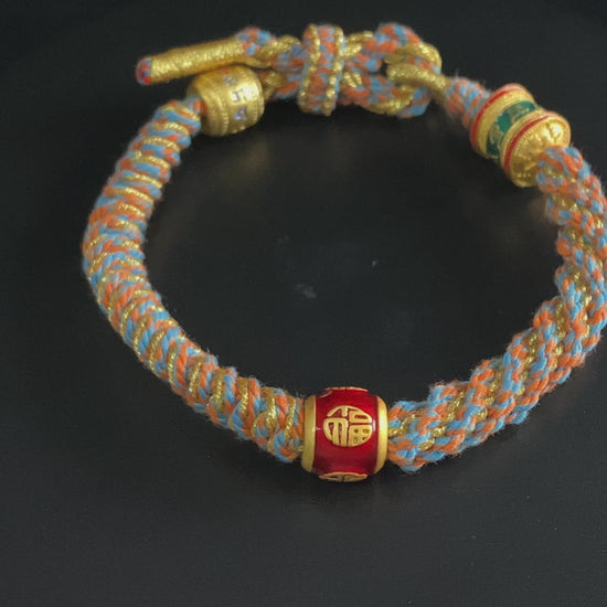 A mantra fortune woven tibetan bracelet.