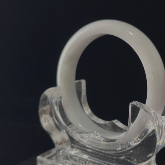 A cloudy milk white jadeite bangle.