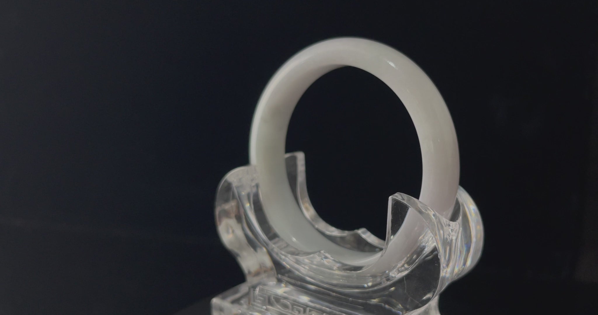 A cloudy milk white jadeite bangle.
