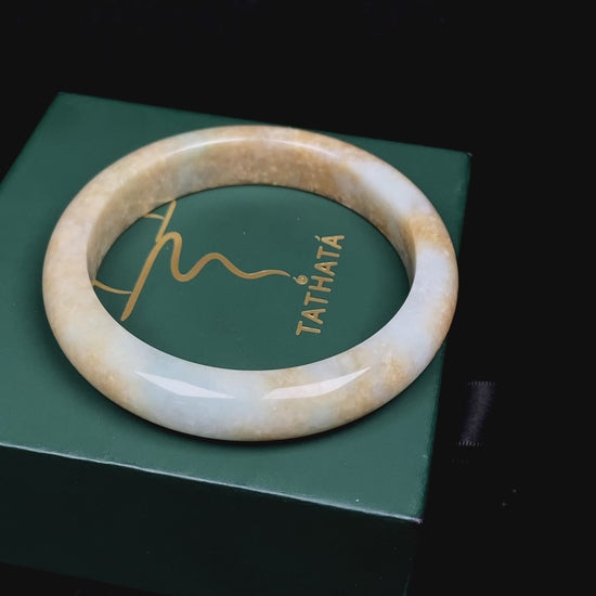 Golden shimmers sprinkling lightly jadeite bangle.