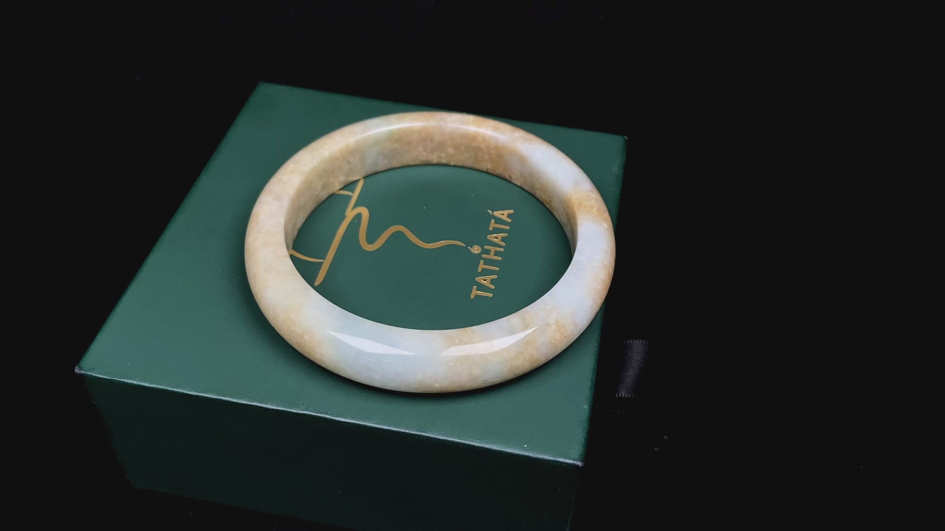 Golden shimmers sprinkling lightly jadeite bangle.