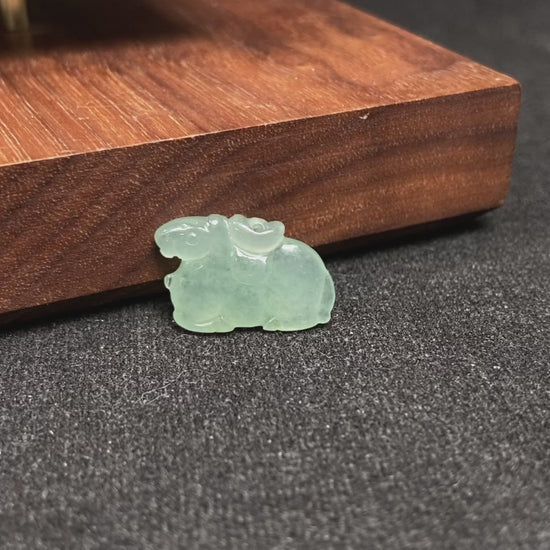 A wispy mint green horse loose jadeite.