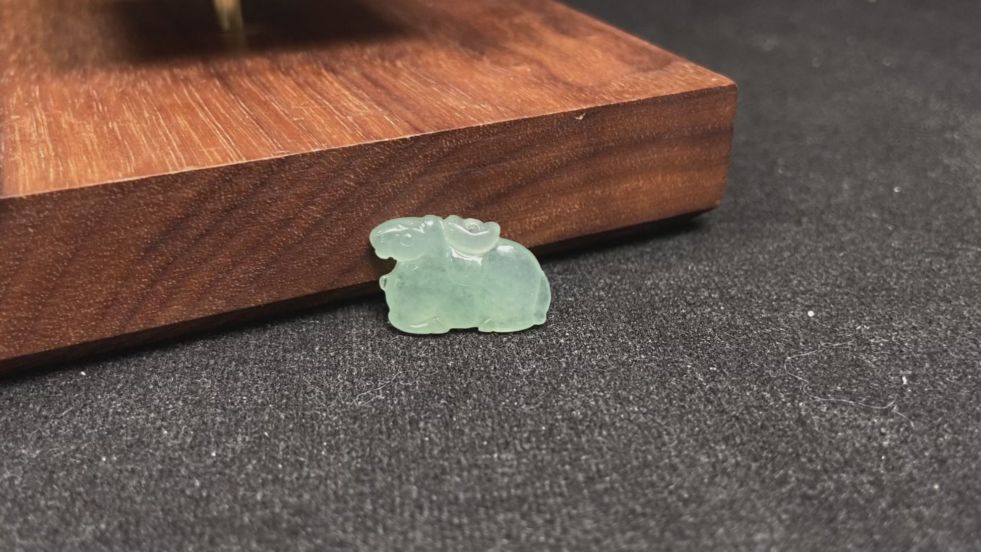 A wispy mint green horse loose jadeite.