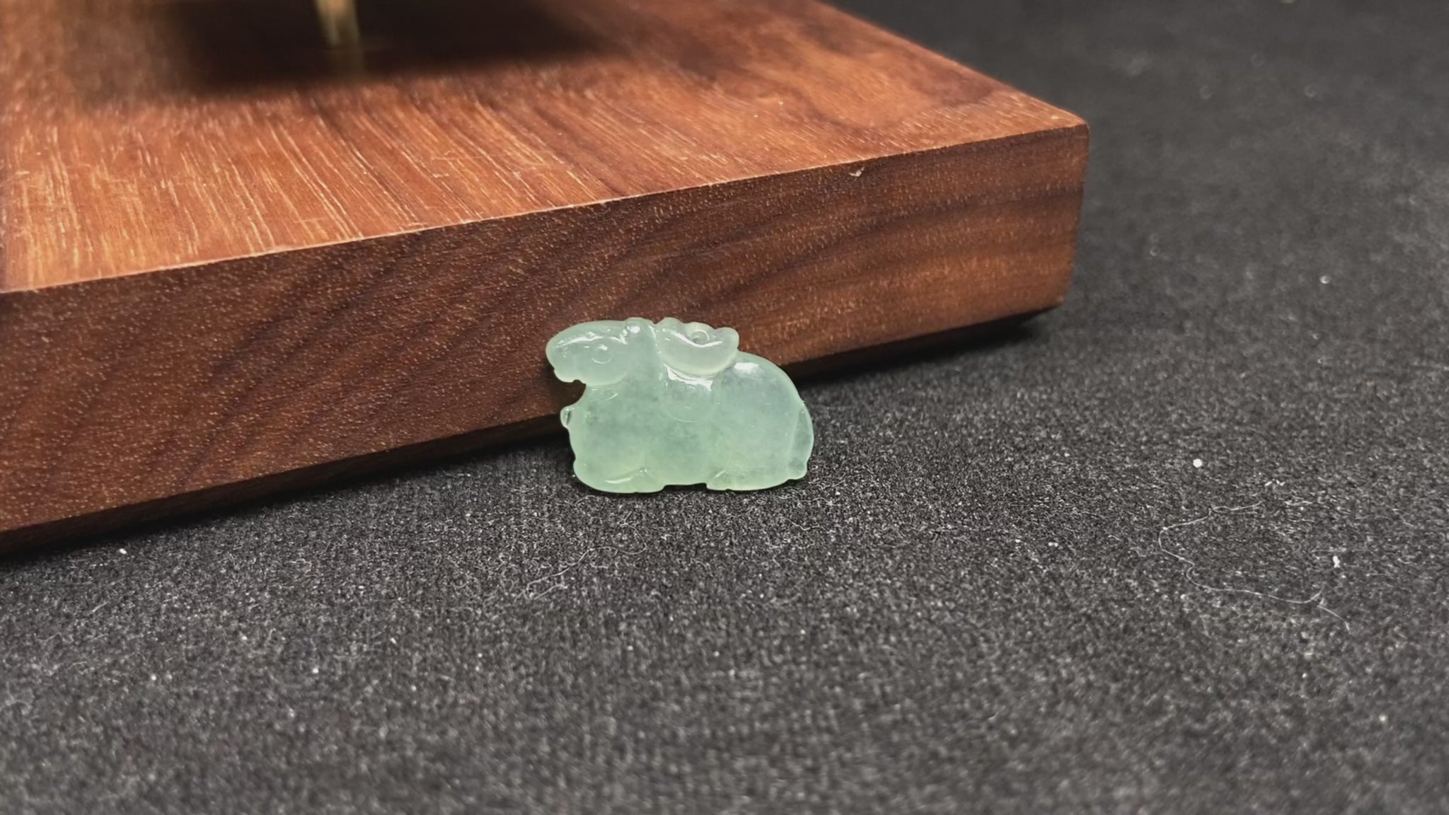 A wispy mint green horse loose jadeite.