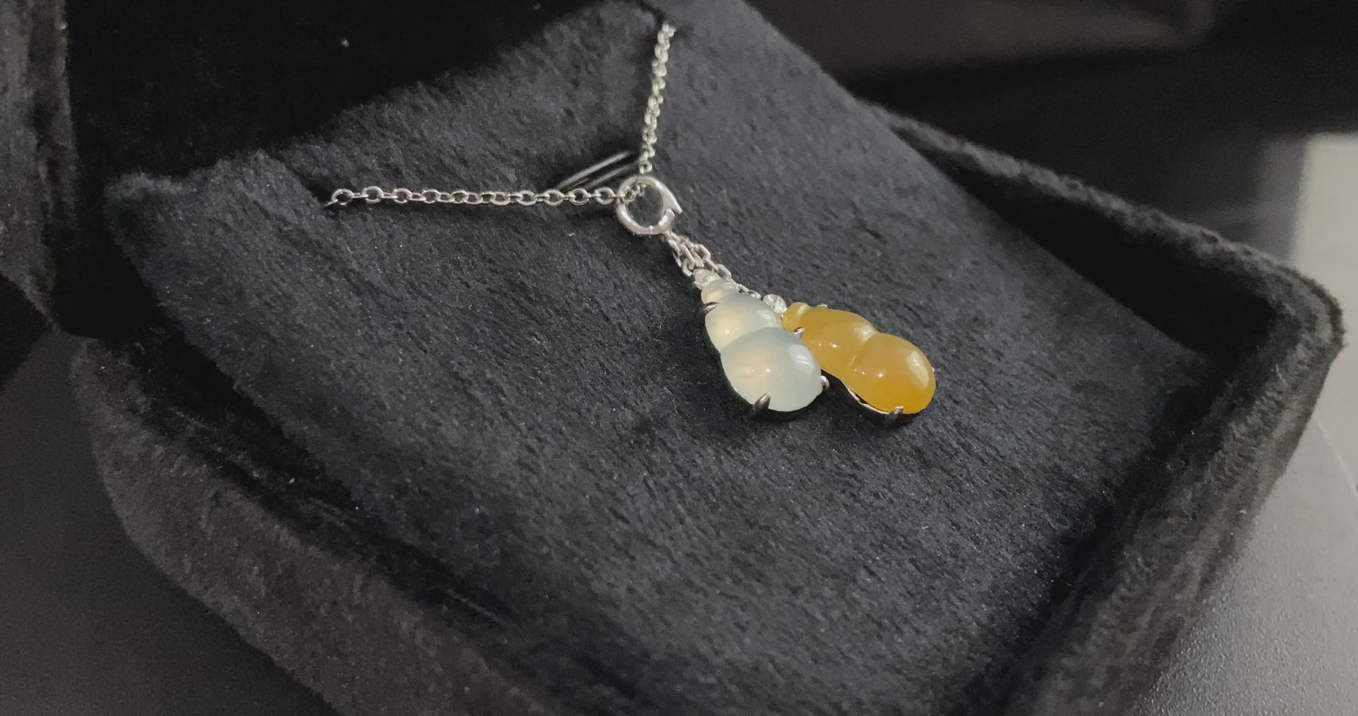 A sun and moon twin gourds jadeite pendant.