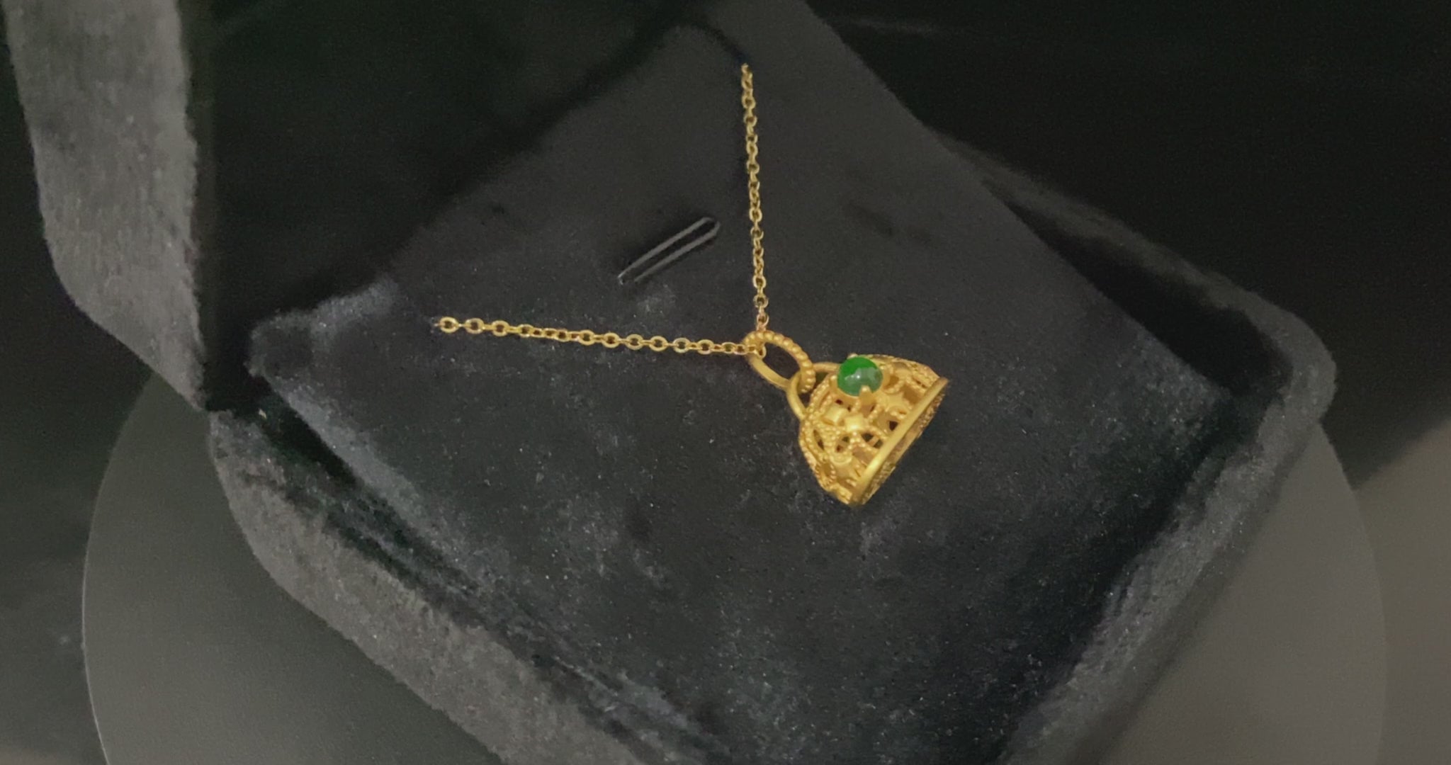 A auspicious green latch jadeite pendant.