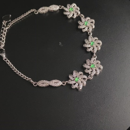 A lime green flowerburs jadeite bracelet.
