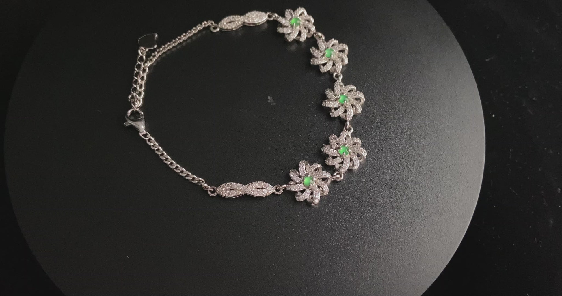 A lime green flowerburs jadeite bracelet.