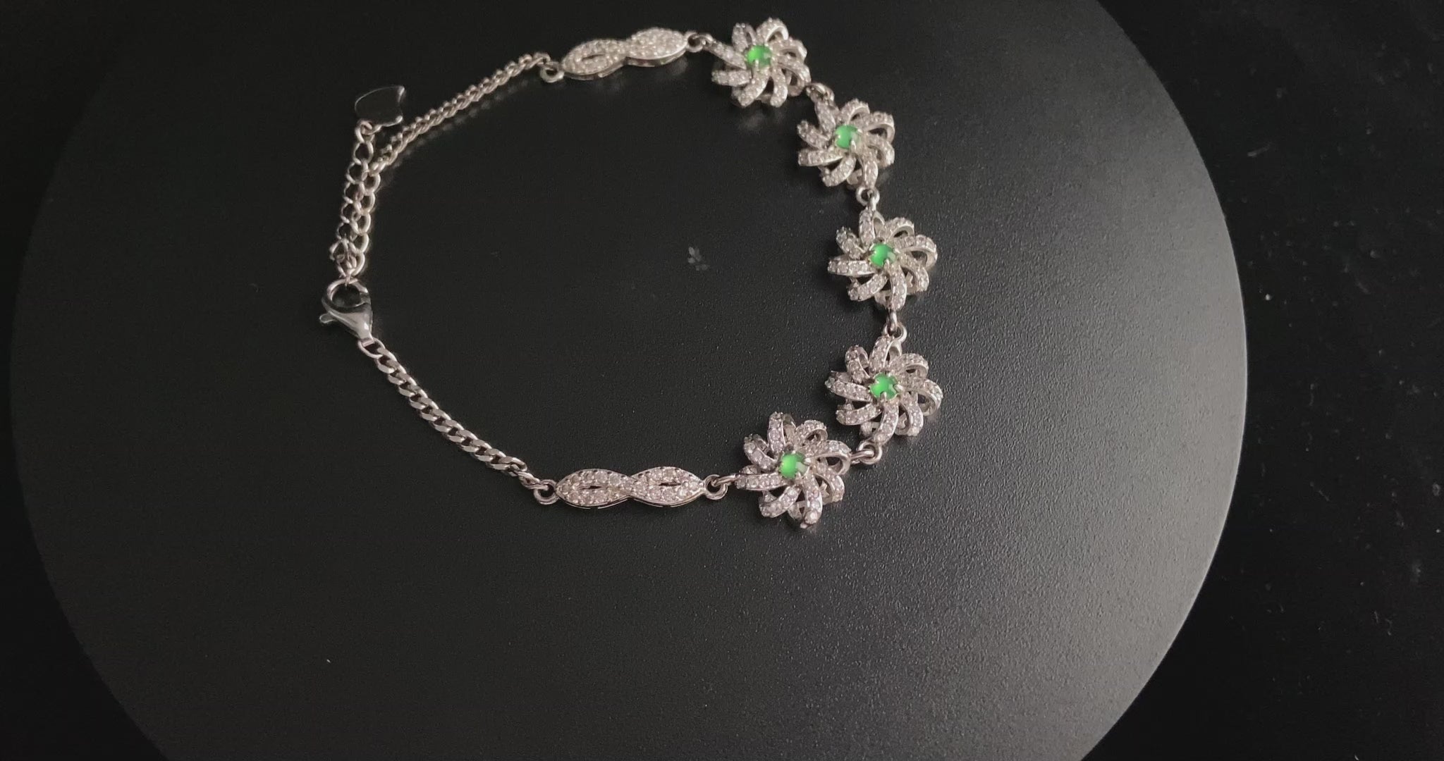 A lime green flowerburs jadeite bracelet.