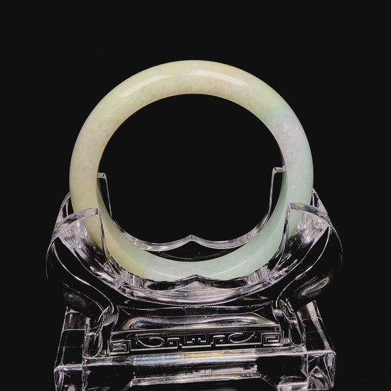 Golden shimmers sprinkling lightly jadeite bangle.