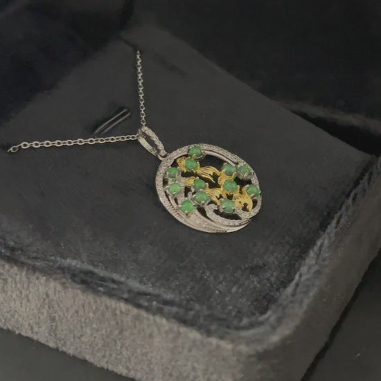 A green koi wreath jadeite pendant.