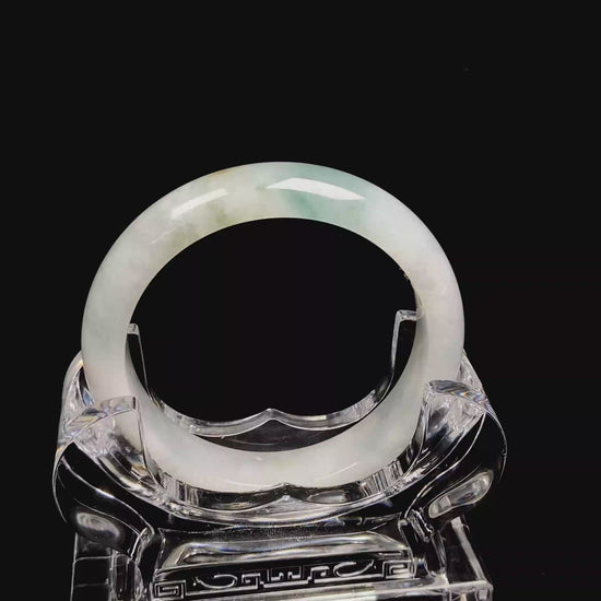 A pale mist azure jadeite bangle.