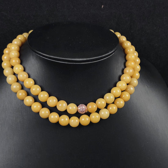 A warm amber golden hues jadeite beads bracelet.