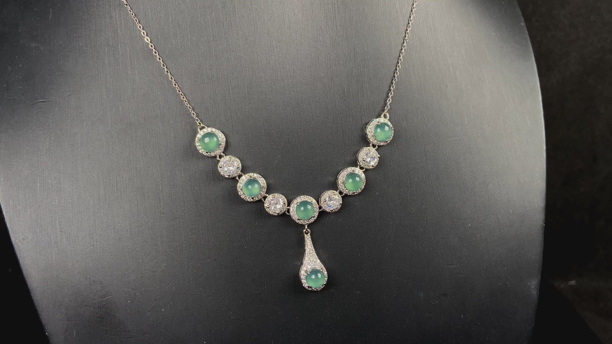A lush green teardrop jadeite pendant.