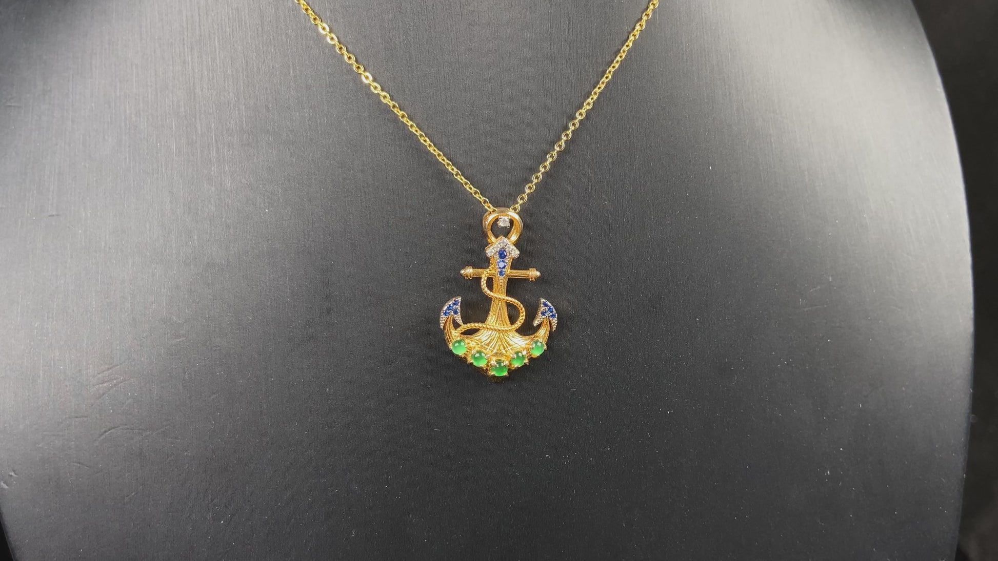 A vivid green anchor fortune jadeite pendant.