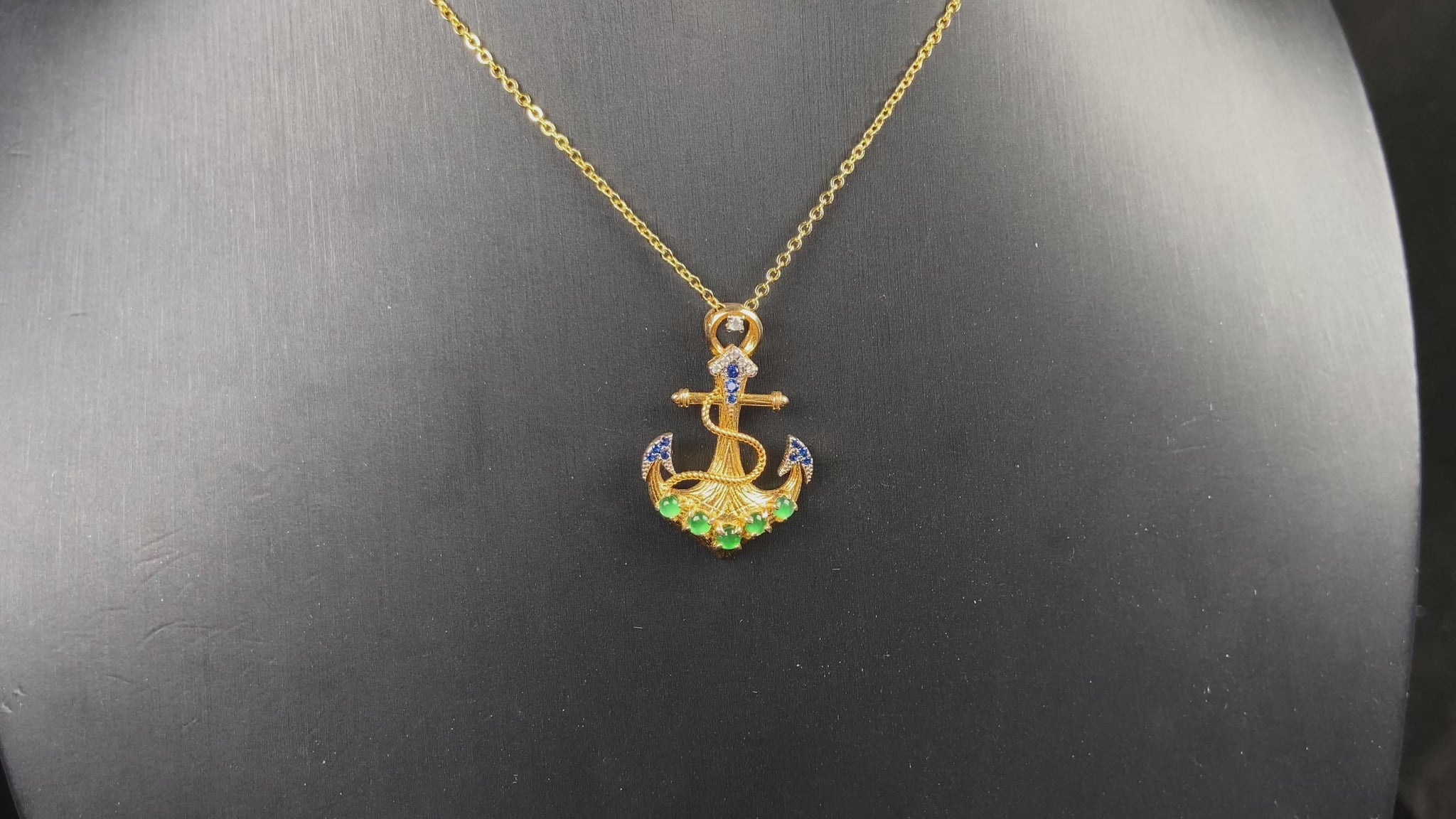 A vivid green anchor fortune jadeite pendant.