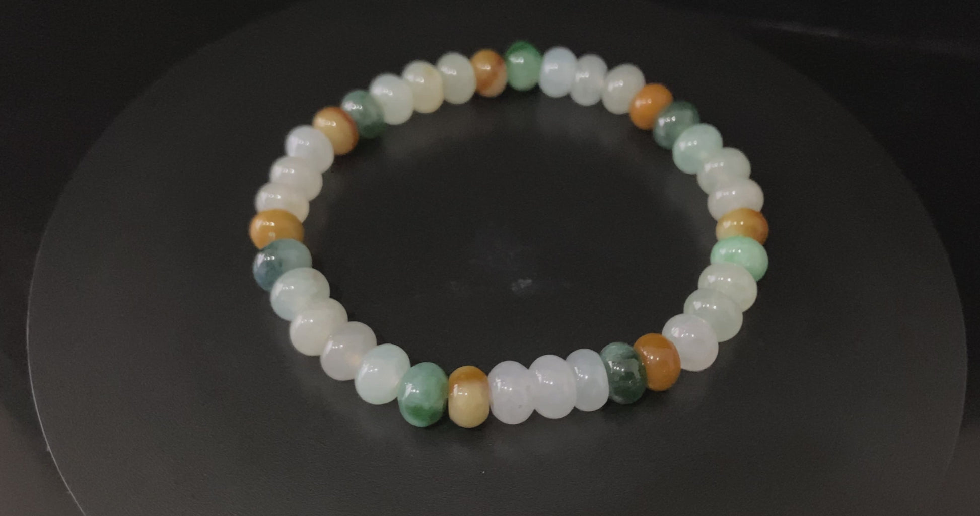 A misty seasonal tones jadeite beads bracelet.