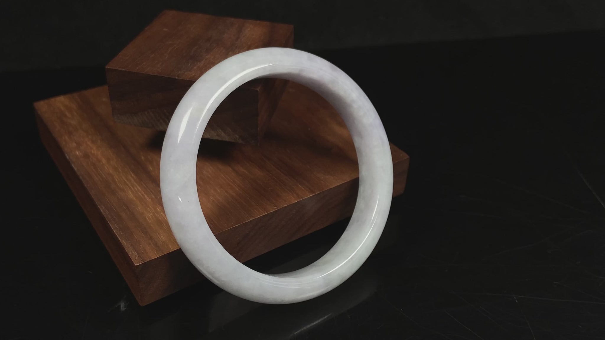 A milky white serenity jadeite bangle.