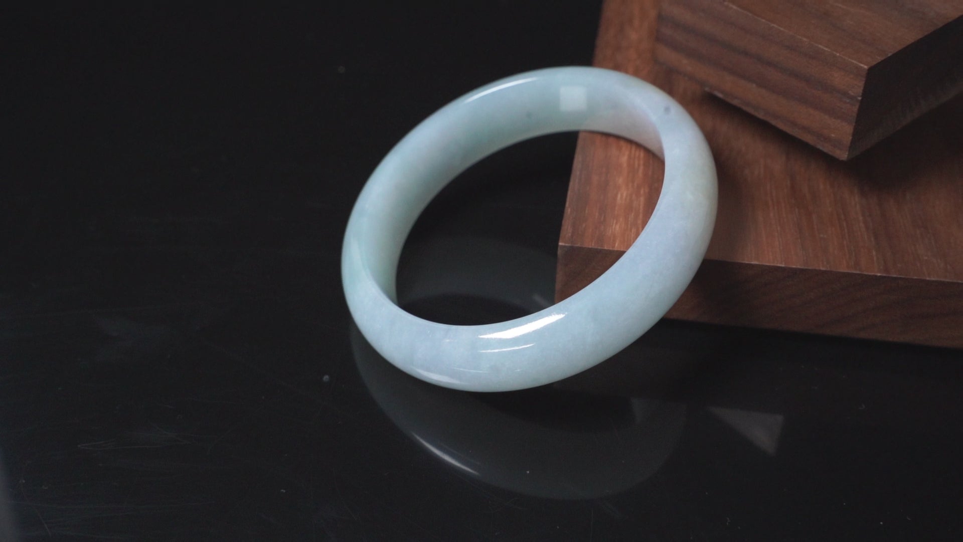 A pale frosty jadeite bangle.
