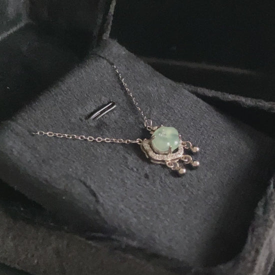 A ice green Ruyi chime jadeite pendant.