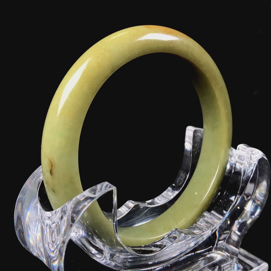 A golden lime jadeite bangle.