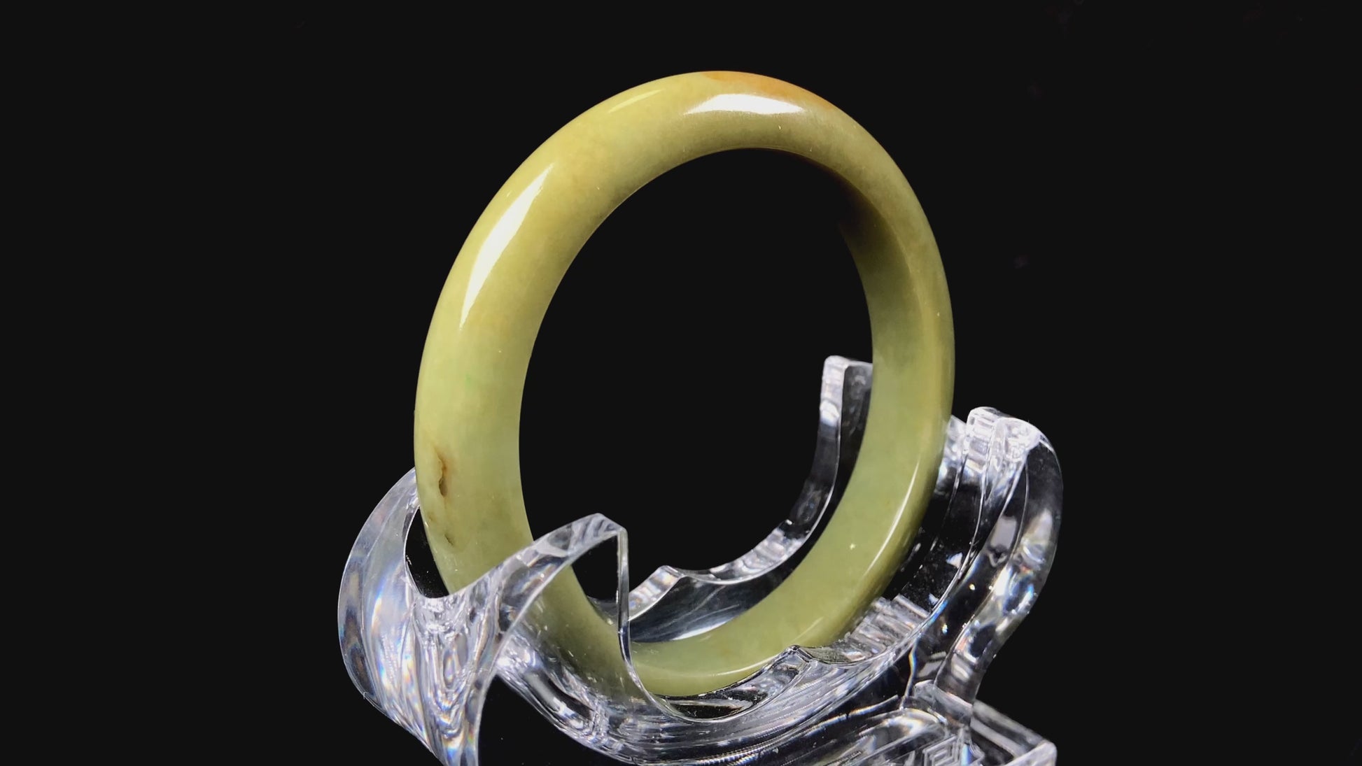 A golden lime jadeite bangle.