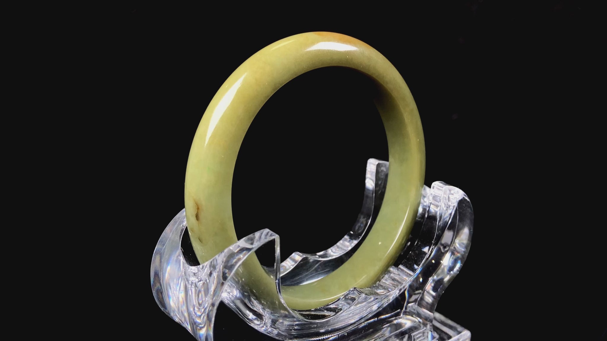 A golden lime jadeite bangle.