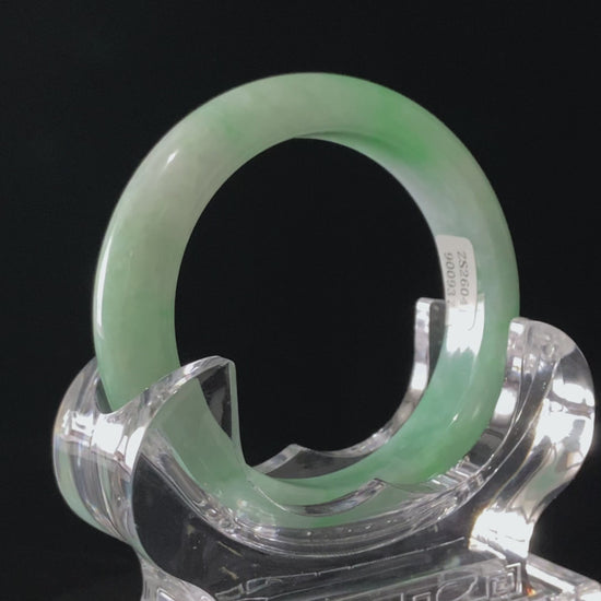 A moss green cloud  jadeite bangle.