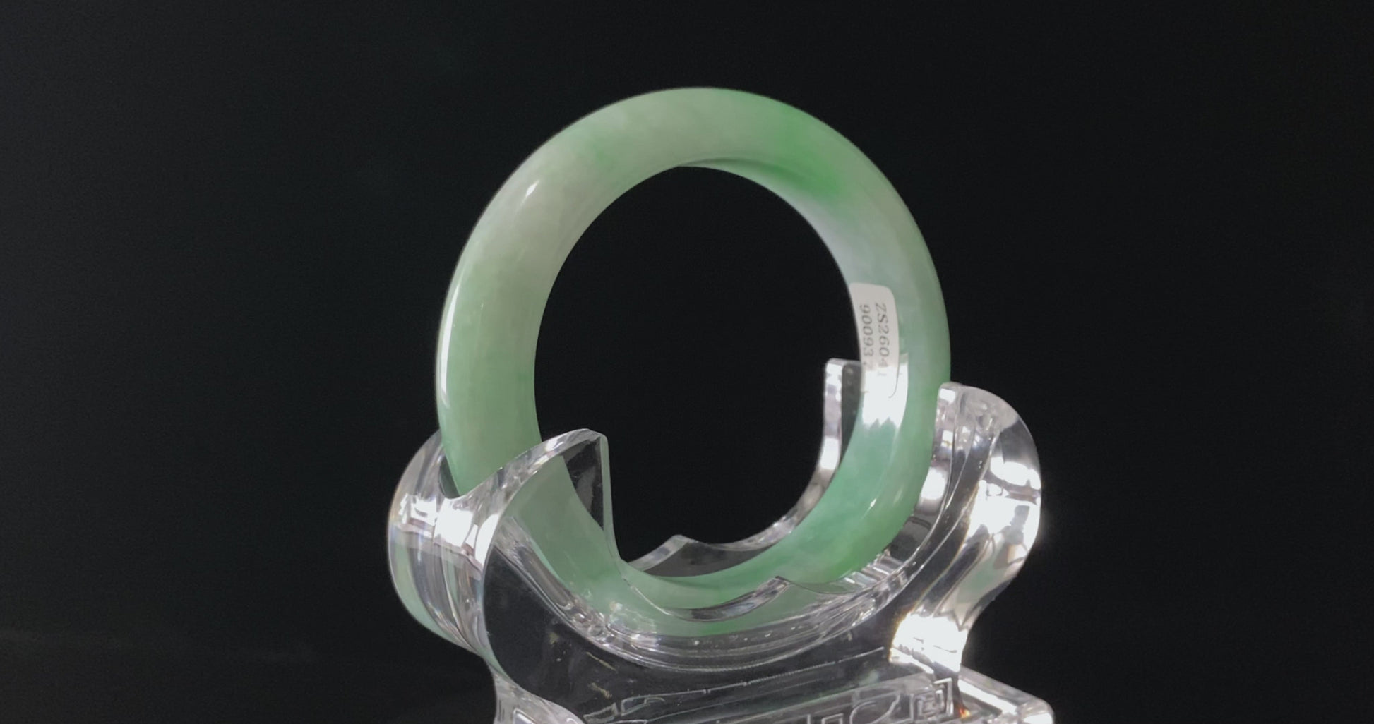 A moss green cloud  jadeite bangle.
