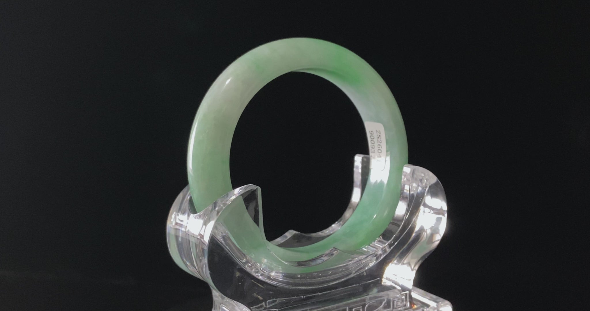 A moss green cloud  jadeite bangle.