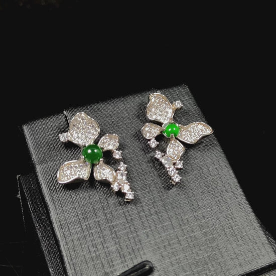 A pair of sparkling petal green core jadeite earrings.
