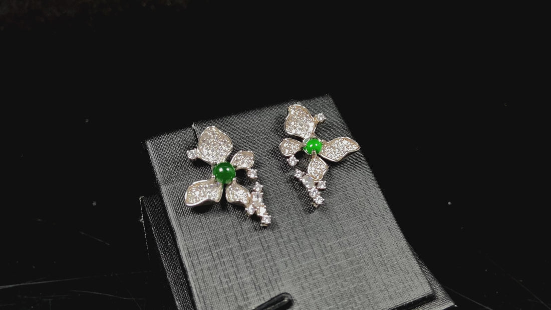 A pair of sparkling petal green core jadeite earrings.