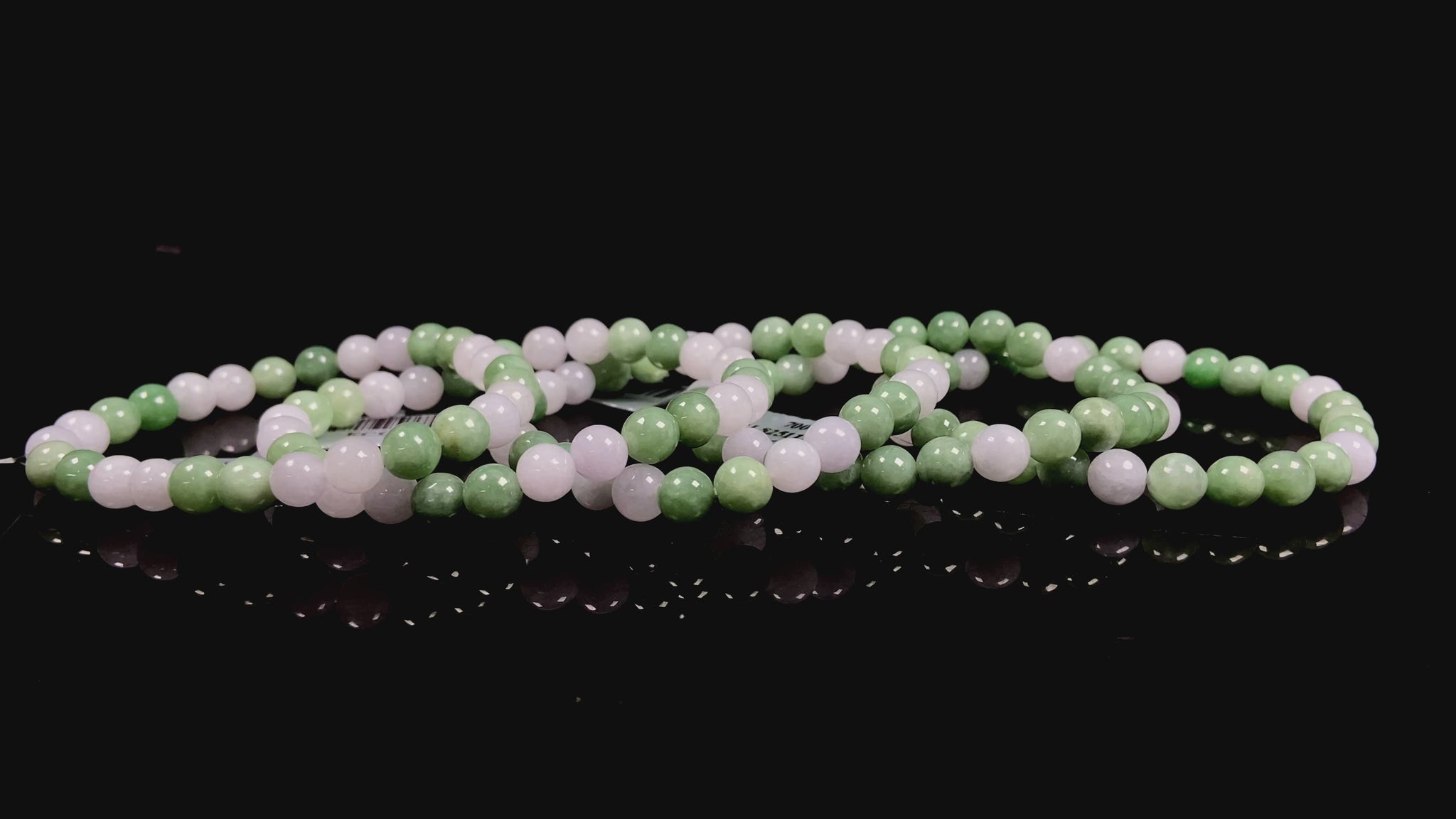 A verdant white peace jadeite beads bracelet group.