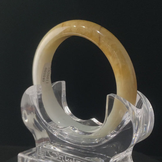 A sundrop amber glow jadeite bangle.
