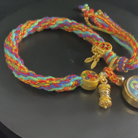 A chenrezig gau ainbow woven bracelet.