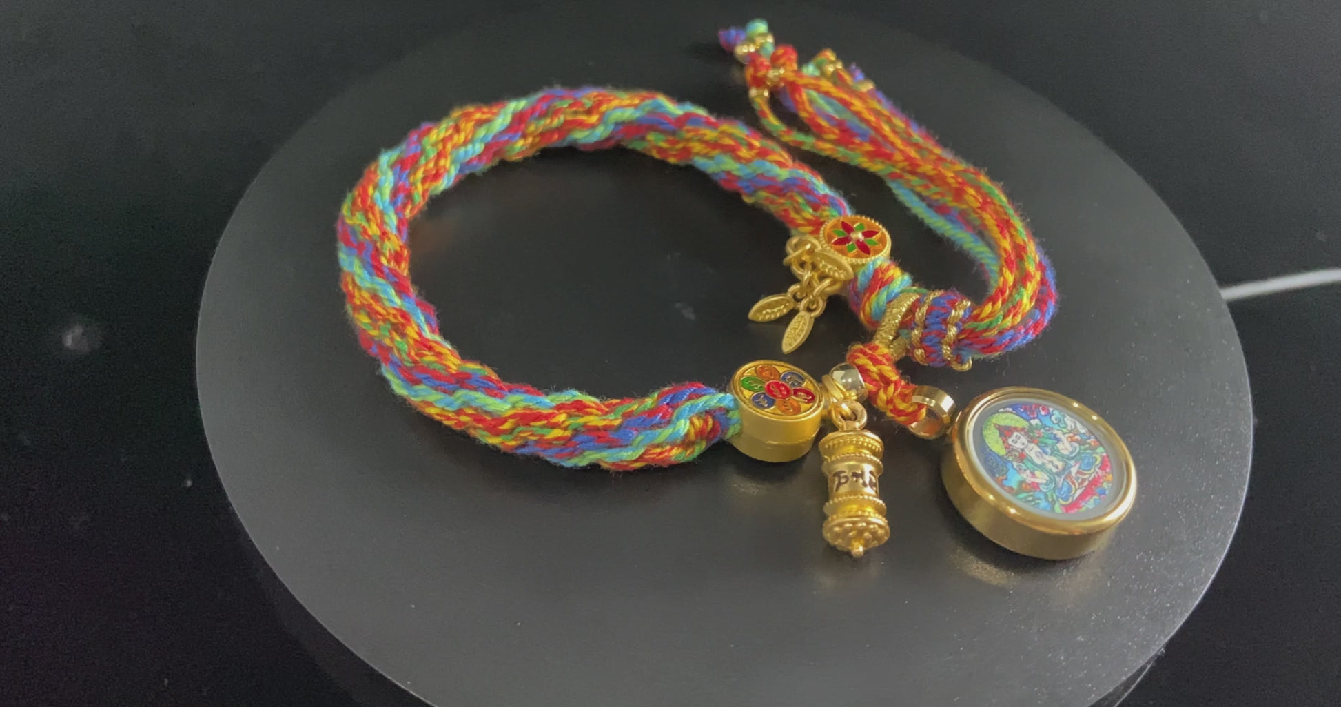 A chenrezig gau ainbow woven bracelet.