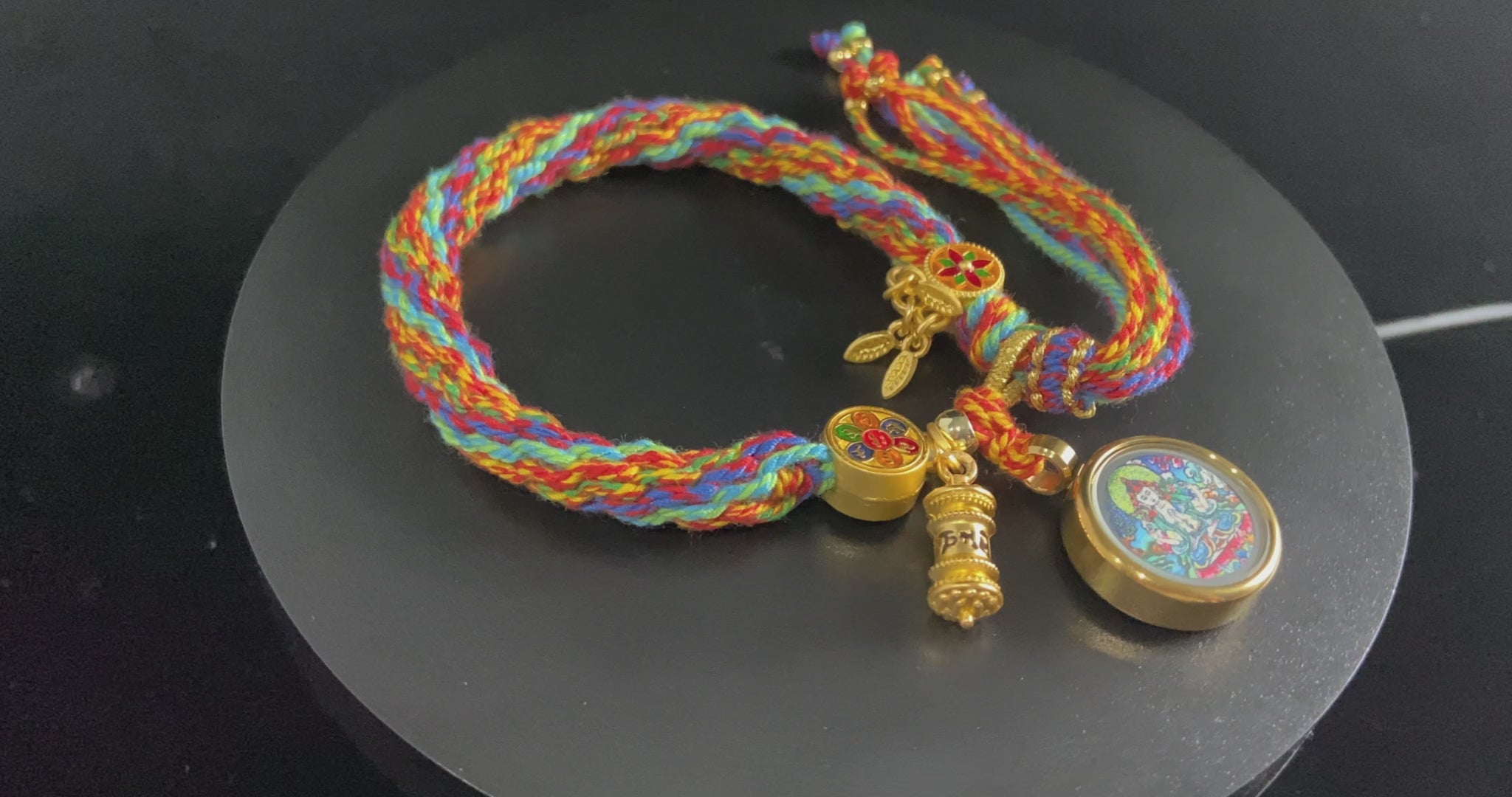 A chenrezig gau ainbow woven bracelet.