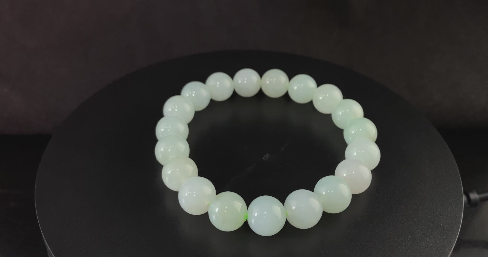 A milky pale green calm jadeite beads bracelet.