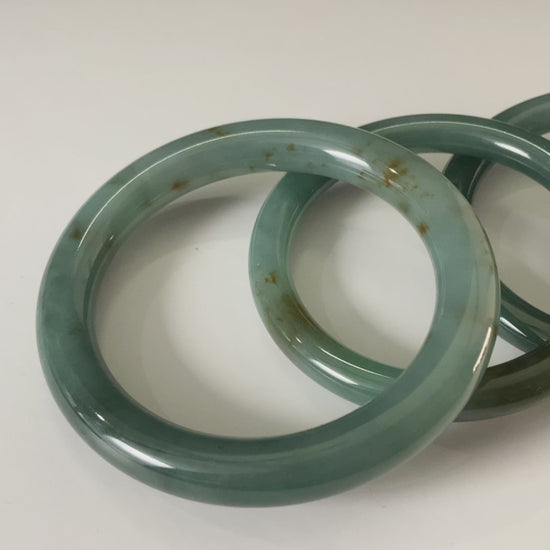 A honey green mist jadeite bangle.